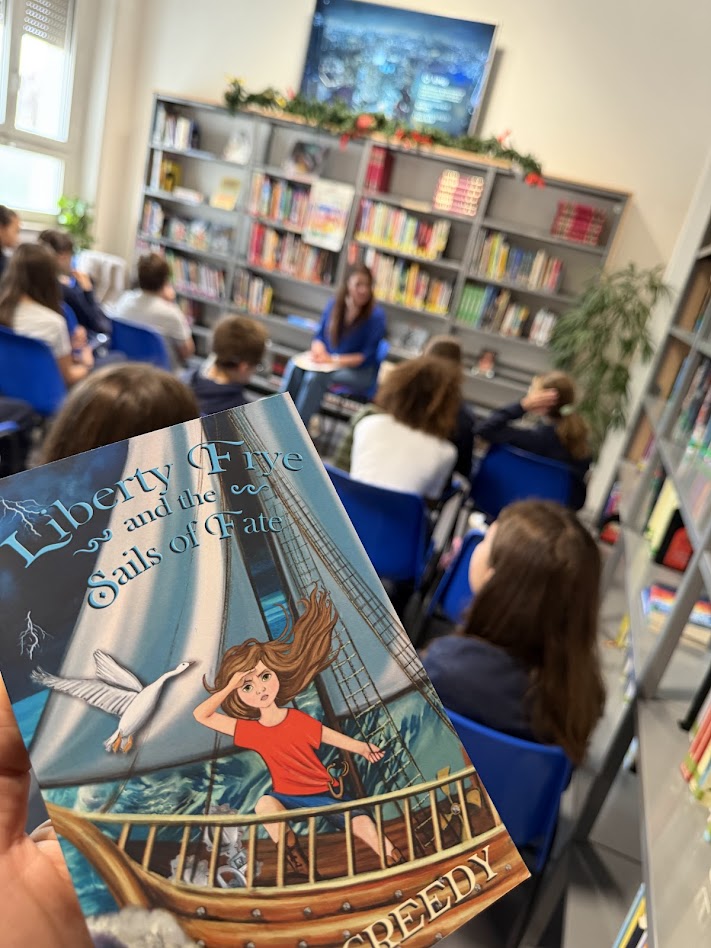 Author J.L. McCreedy visiting with elementary children at H-Farm International School's library in Vicenza, Italy
